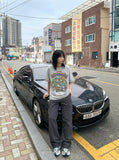 DAXUEN Graphic t-shirt featuring aliens at a pool party — model photo