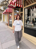 DAXUEN Short-sleeved button-up shirt with racing graphics — model photo