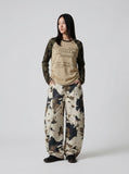 DAXUEN Long-sleeve raglan top with camouflage sleeves and star print — model photo