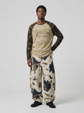 DAXUEN Long-sleeve raglan top with camouflage sleeves and star print — model photo