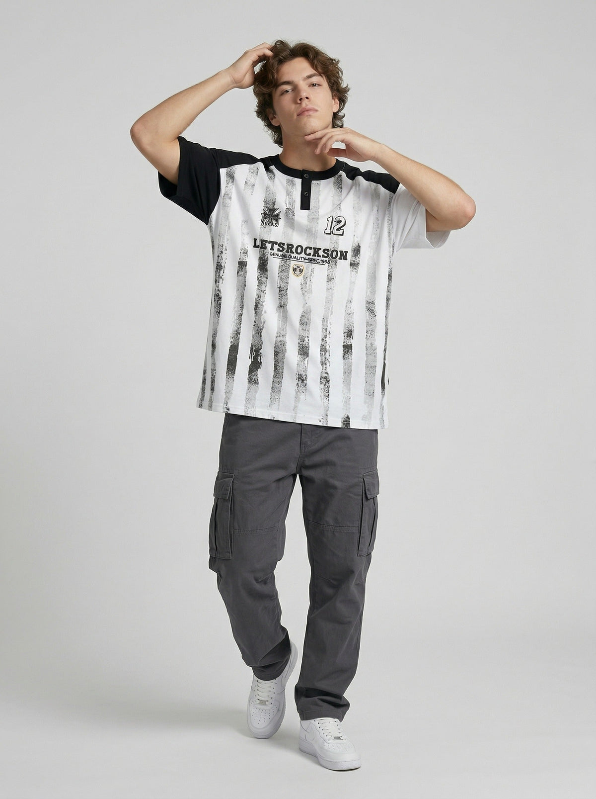 DAXUEN Raglan short-sleeved T-shirt with vertical stripes and graphics — model photo