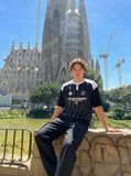 DAXUEN Raglan short-sleeved T-shirt with vertical stripes and graphics — model photo
