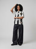 DAXUEN dark indigo raw denim wide-leg jeans with drawstring detail — model photo