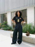 DAXUEN dark indigo raw denim wide-leg jeans with drawstring detail — model photo