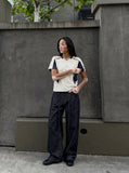 DAXUEN dark indigo raw denim wide-leg jeans with drawstring detail — model photo