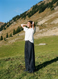 DAXUEN dark indigo raw denim wide-leg jeans with drawstring detail — model photo