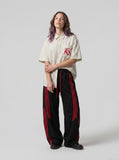 DAXUEN cream oversized striped button-up shirt with red embroidery — model photo