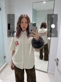 DAXUEN cream oversized striped button-up shirt with red embroidery — model photo