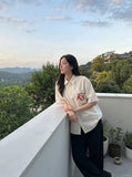 DAXUEN cream oversized striped button-up shirt with red embroidery — model photo