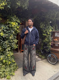 DAXUEN washed black distressed red-embroidered wide-leg jeans — model photo
