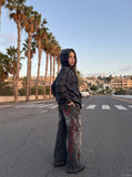 DAXUEN washed black distressed red-embroidered wide-leg jeans — model photo