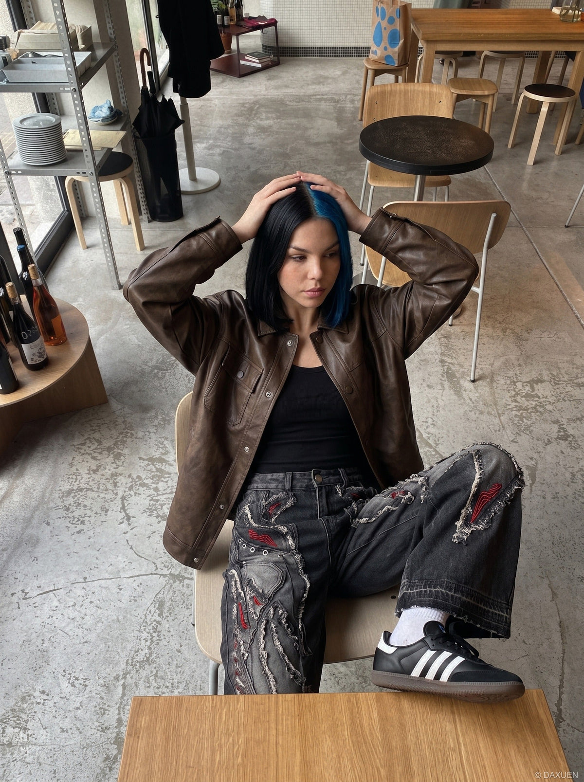 DAXUEN washed black distressed red-embroidered wide-leg jeans — model photo