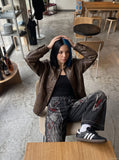 DAXUEN washed black distressed red-embroidered wide-leg jeans — model photo