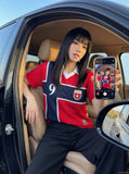 DAXUEN red oversized mesh polo with navy cross graphic — model photo