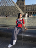 DAXUEN red oversized mesh polo with navy cross graphic — model photo