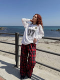 DAXUEN black balloon leg striped casual pants — model photo