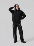 DAXUEN Reflective piping long sleeve top in black and grey — model photo