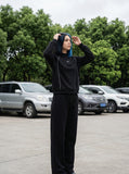DAXUEN Reflective piping long sleeve top in black and grey — model photo