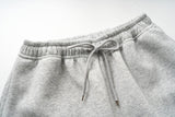 DAXUEN light grey marl wide-leg sweatpants with reflective wing graphic