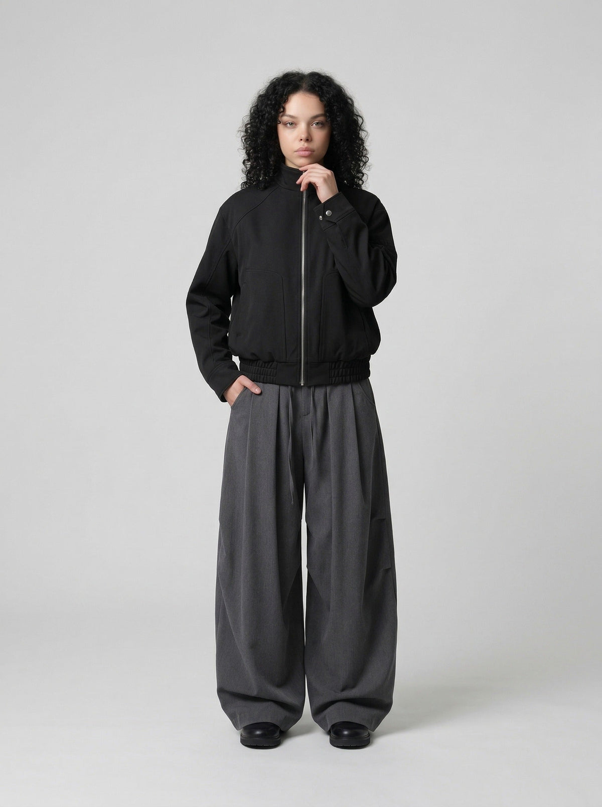 DAXUEN Unisex relaxed fit bomber jacket with pockets — model photo