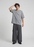 DAXUEN Relaxed fit short-sleeved top in grey and black — model photo