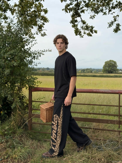 DAXUEN Relaxed fit short-sleeved top in grey and black — model photo