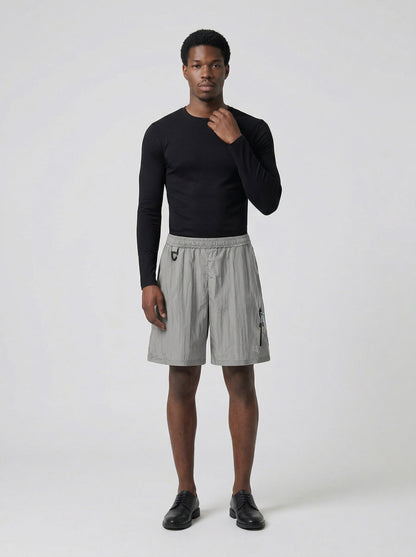 DAXUEN Relaxed fit shorts with crinkled texture and logo — model photo