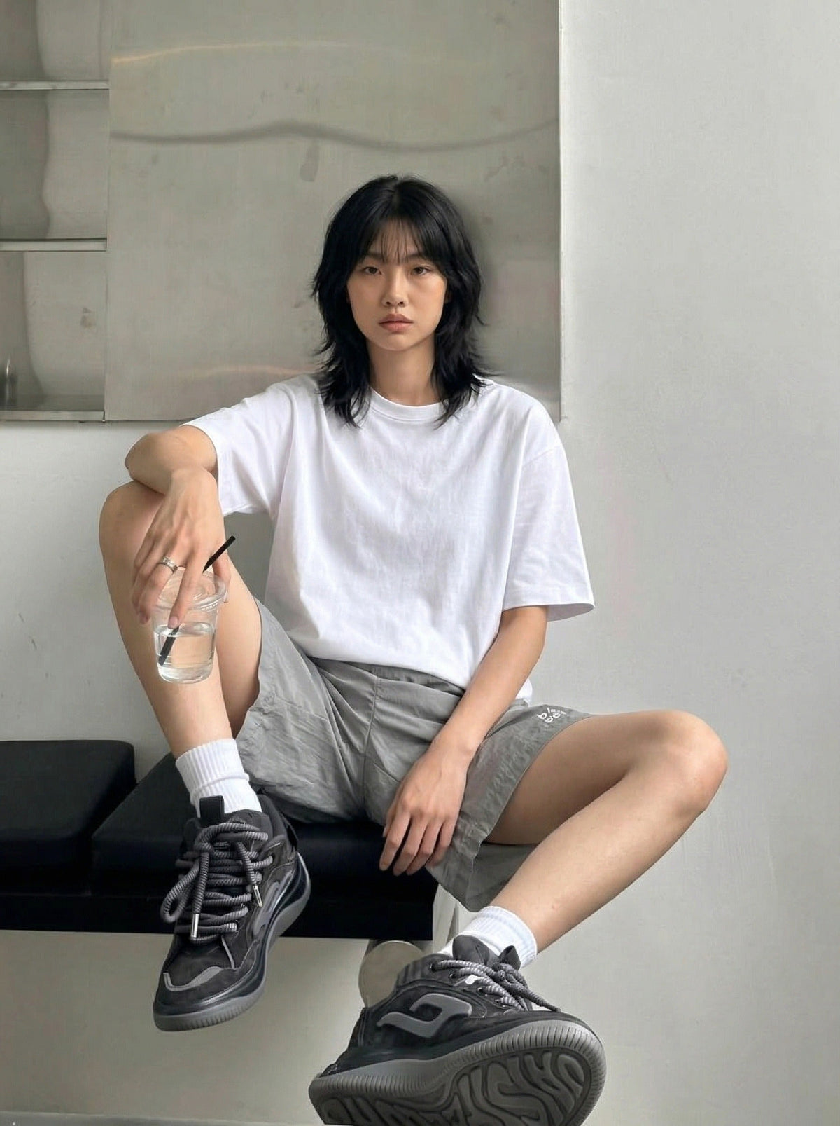 DAXUEN Relaxed fit shorts with crinkled texture and logo — model photo