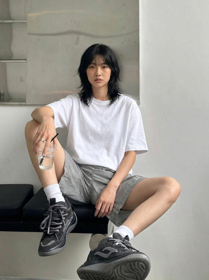 DAXUEN Relaxed fit shorts with crinkled texture and logo — model photo