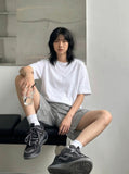 DAXUEN Relaxed fit shorts with crinkled texture and logo — model photo