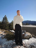 DAXUEN Oversized long-sleeved mock neck top — model photo