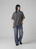 DAXUEN Relaxed oversized short-sleeve top with zippered pockets — model photo