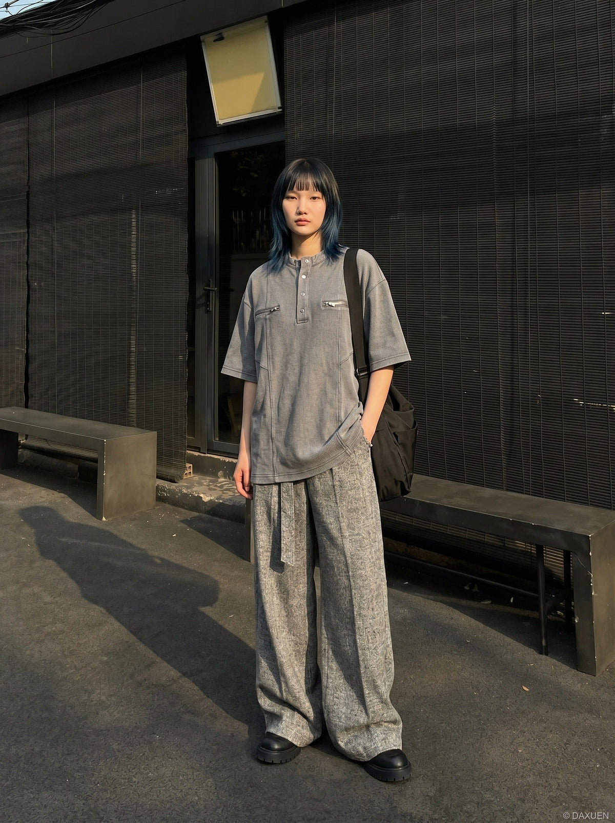 DAXUEN Relaxed oversized short-sleeve top with zippered pockets — model photo