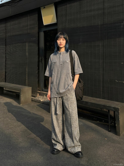 DAXUEN Relaxed oversized short-sleeve top with zippered pockets — model photo