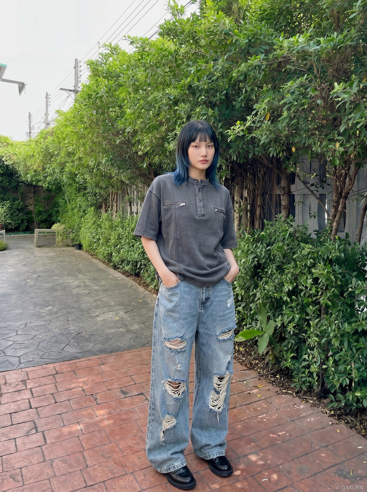 DAXUEN Relaxed oversized short-sleeve top with zippered pockets — model photo