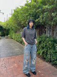 DAXUEN Relaxed oversized short-sleeve top with zippered pockets — model photo