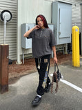 DAXUEN Relaxed oversized short-sleeve top with zippered pockets — model photo