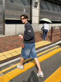 DAXUEN Relaxed wide-leg denim shorts — model photo