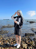 DAXUEN Relaxed wide-leg denim shorts — model photo