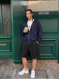 DAXUEN Wide-leg relaxed-fit shorts in dark grey and black — model photo