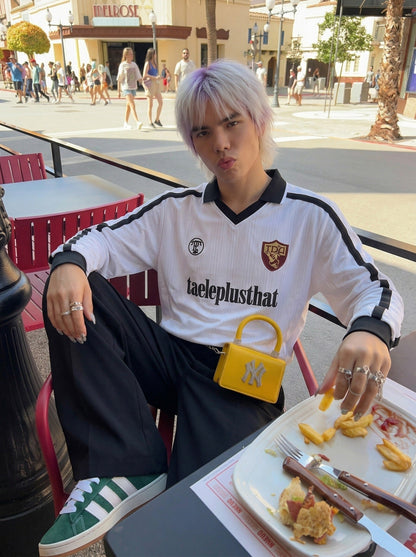 DAXUEN Long sleeve T-shirt styled like a football jersey — model photo