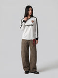 DAXUEN Long sleeve T-shirt styled like a football jersey — model photo