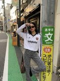 DAXUEN Long sleeve T-shirt styled like a football jersey — model photo