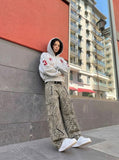 DAXUEN Cropped hooded sweatshirt with graphics — model photo