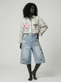 DAXUEN Pair of high-waisted, wide-leg denim culotte shorts — model photo
