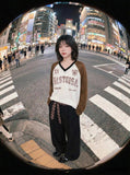 DAXUEN Long-sleeved V-neck raglan top with graphics — model photo