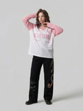 DAXUEN Long-sleeved V-neck raglan top with graphics — model photo