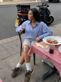 DAXUEN Pair of light grey relaxed-fit herringbone cargo shorts — model photo