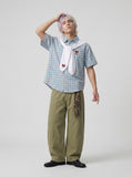 DAXUEN Checkered short-sleeved button-up shirt with embroidered details — model photo