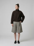 DAXUEN High-waisted wide-leg culotte shorts with micro-check pattern — model photo